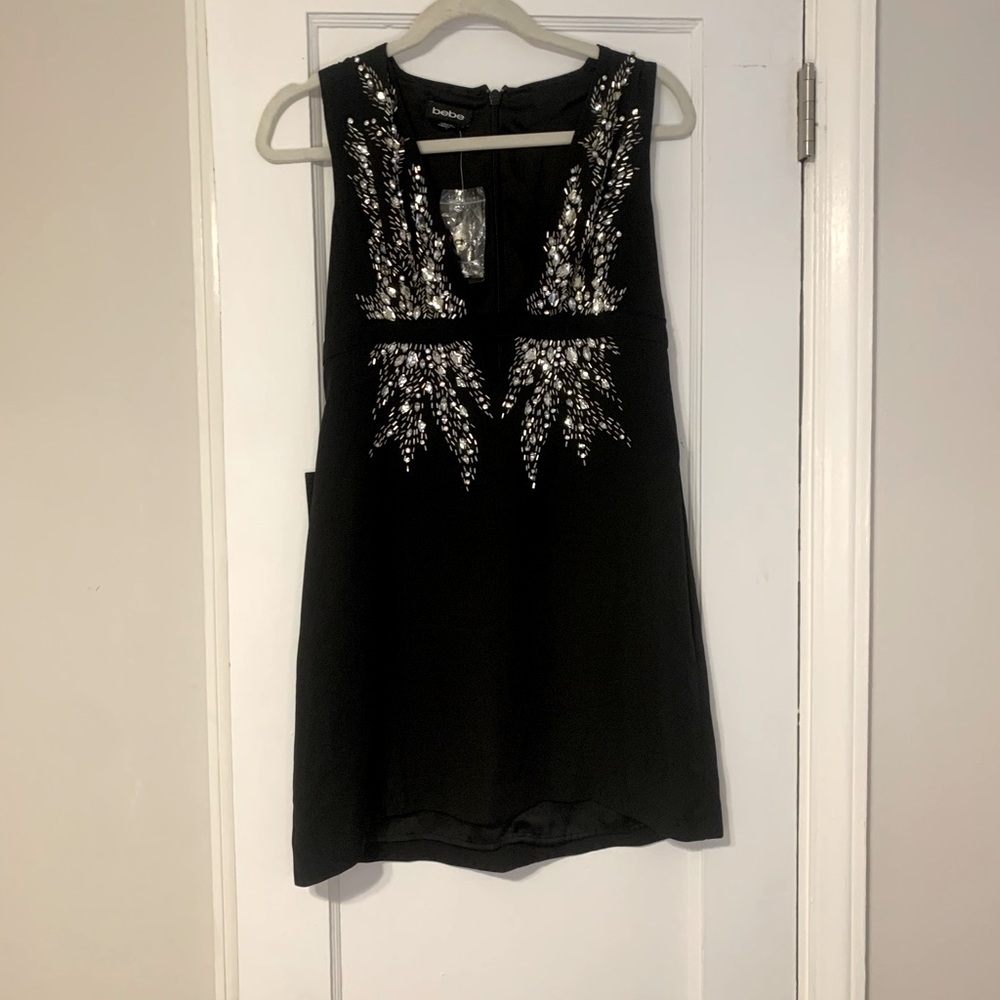 Deep v- neck Bebe black jeweled dress